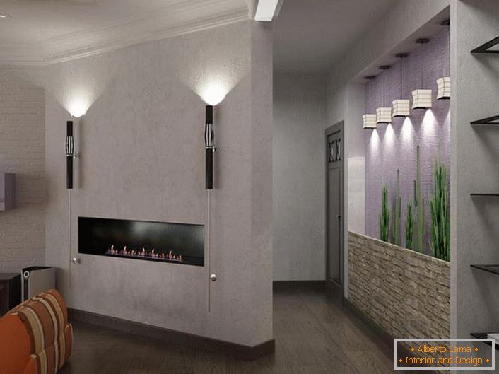 Kamin-sveća ugrađena u zid kao element dekorata dnevne sobe.