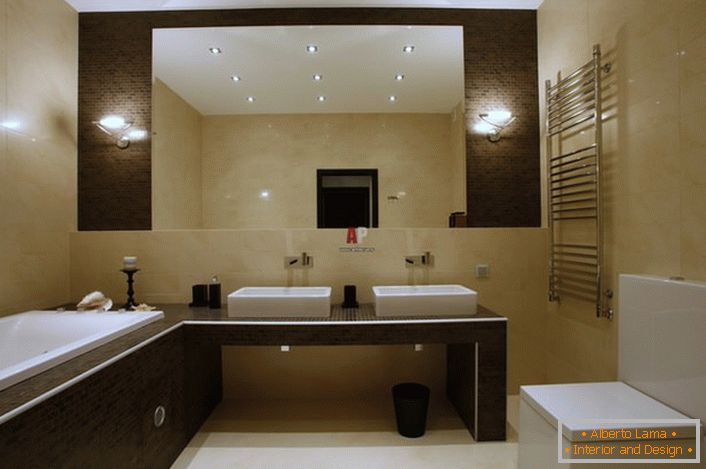 Kupatilo u minimalističkom stilu ukrašeno je svetlom bež i smeđim tonovima. 