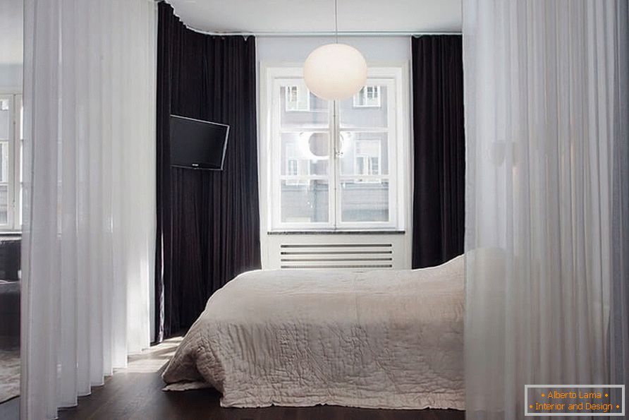 Krevet sa zavjesom u jednosobnom apartmanu od 36 m2